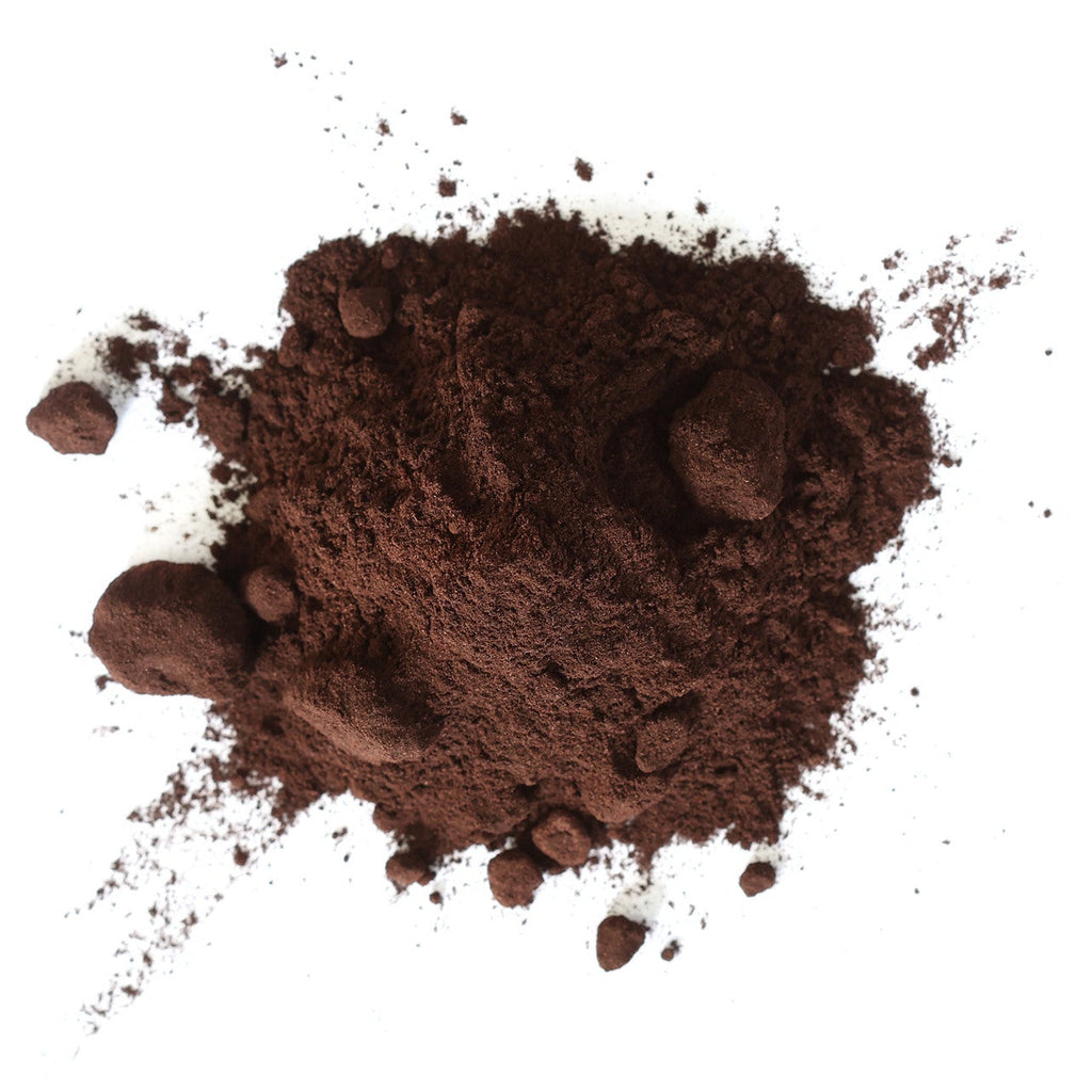 Pile of alkanet root powder on a white background